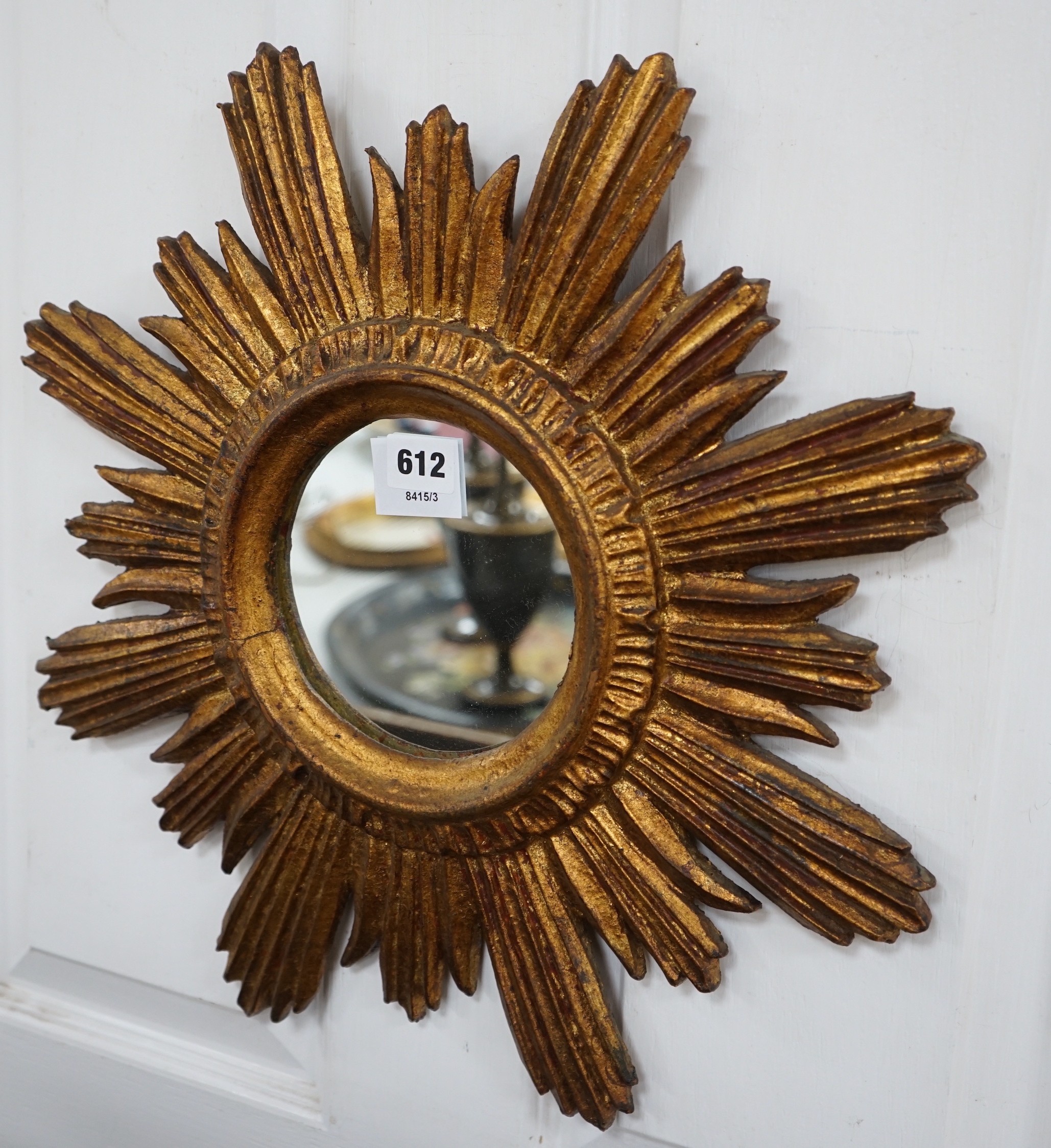 A gilt star-burst wall mirror, 47cm
